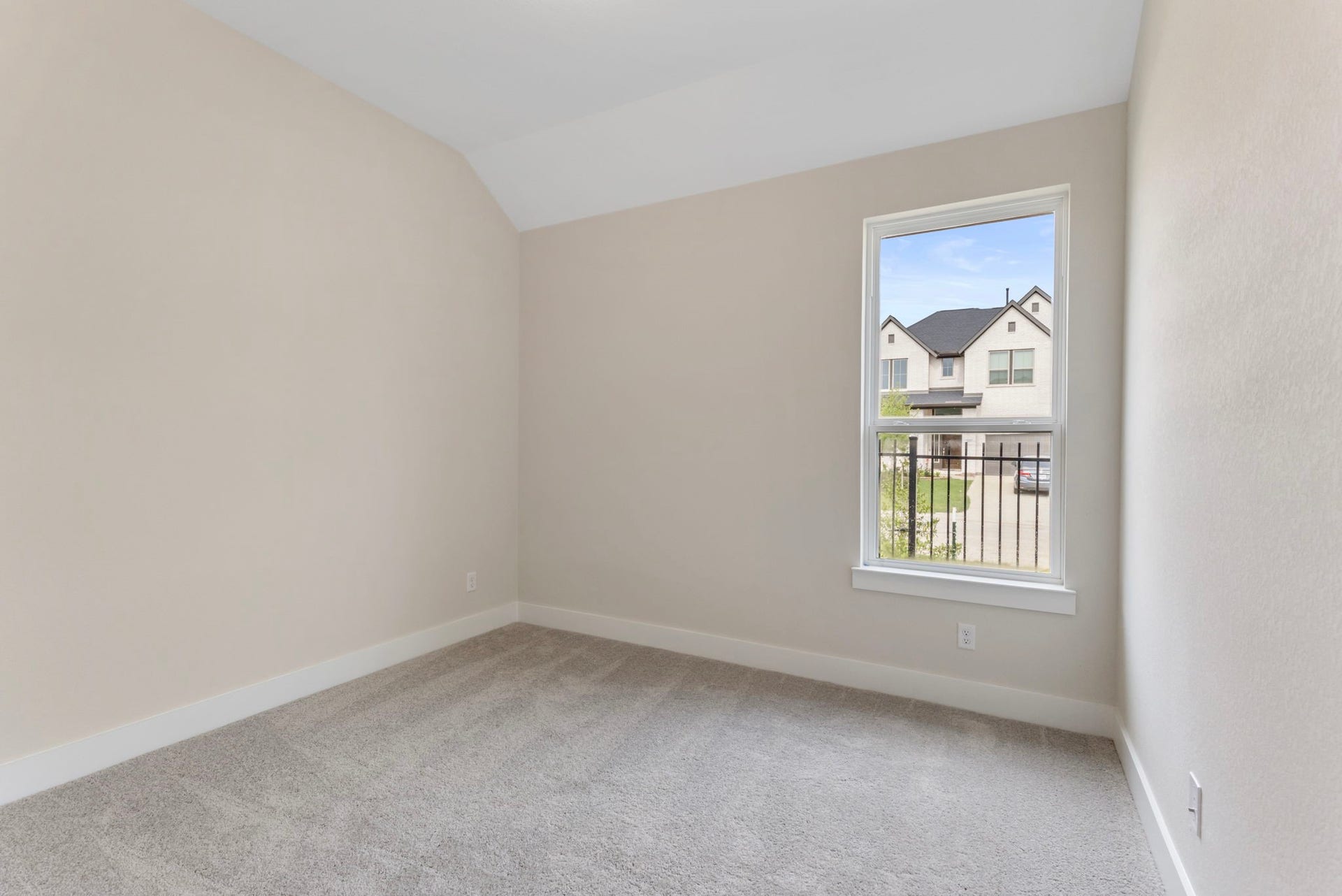 8143 Fenway Heights Dr, The Woodlands, TX 77389 Guest bedroom with window offering a pleasant neighborhood view (no neighbors on that side!)