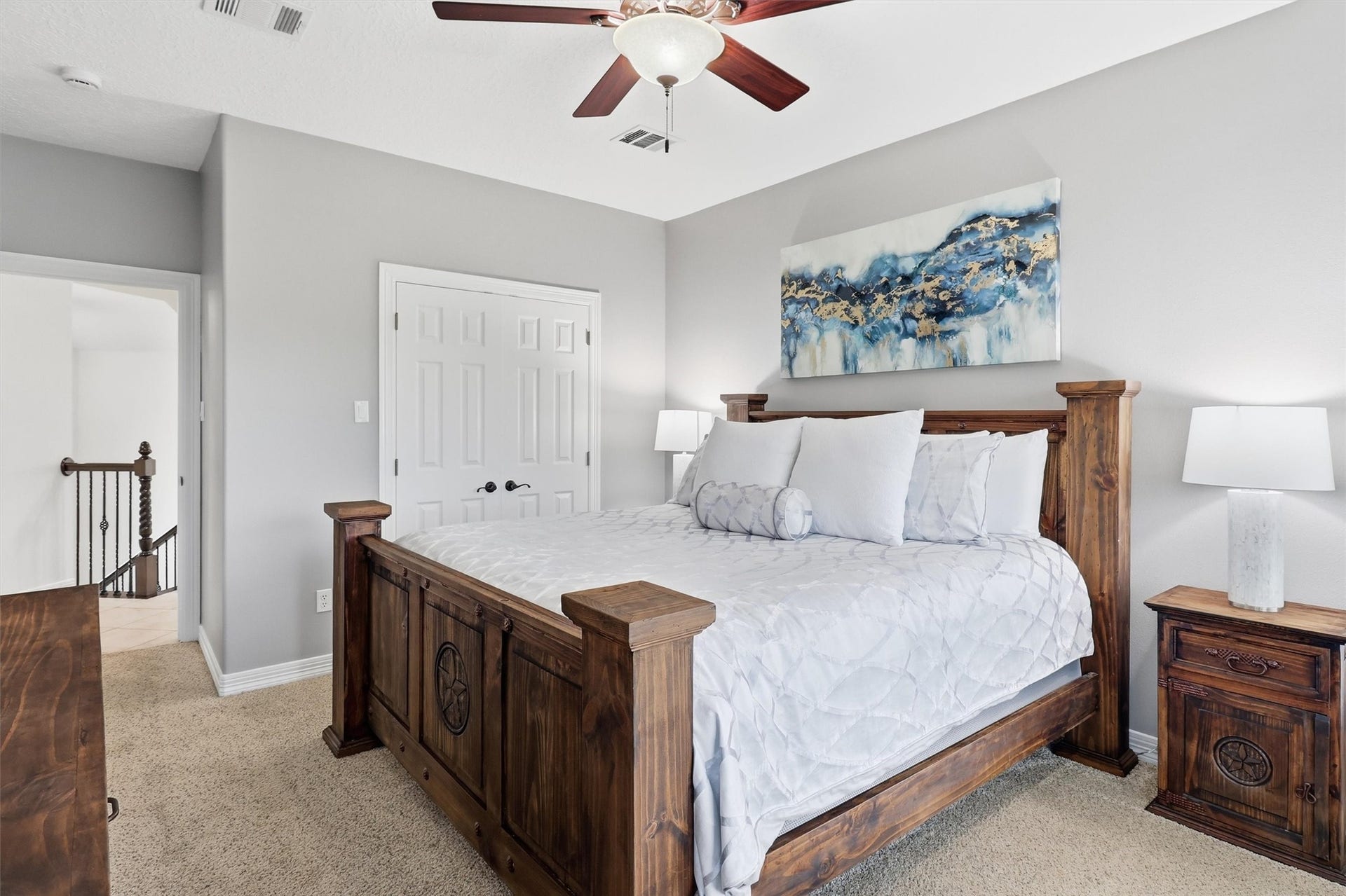 This spacious secondary bedroom offers a full entry closet and a ceiling fan for year-round comfort. Neutral tones and abundant natural light make this a versatile space for any need.