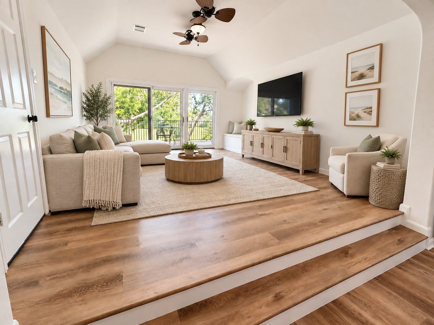 Virtually staged second living area highlights the spacious layout, abundant natural light, and beautiful outdoor viewsperfect for a casual living or game room.