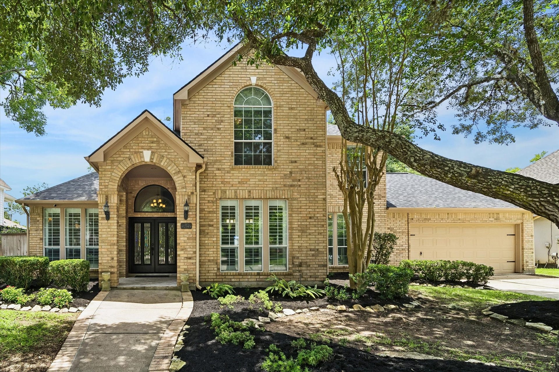 Nestled on a premier golf course lot, this elegant home combines timeless architecture with exceptional curb appeal.