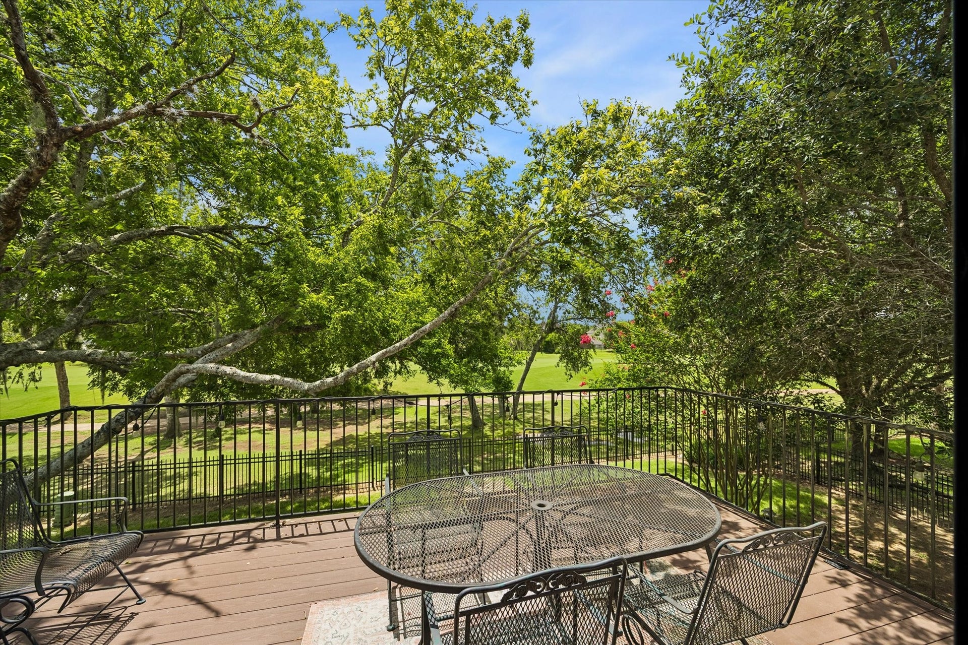 An elevated balcony provides the perfect spot to enjoy your morning coffee or unwind while overlooking the lush fairways.