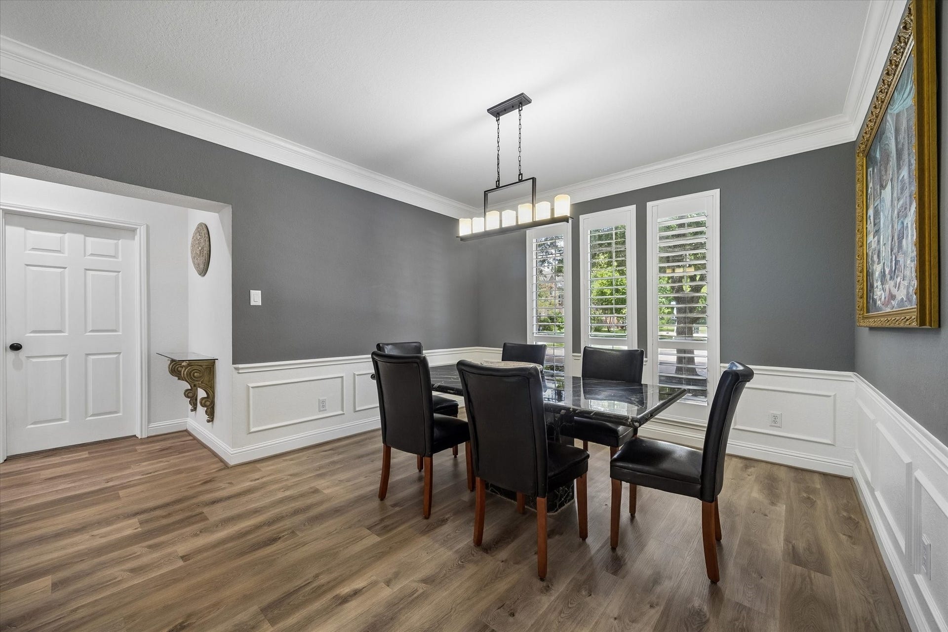 Perfectly positioned off the grand entry, the formal dining room features oversized windows, abundant natural light, and an elegant setting for memorable gatherings.