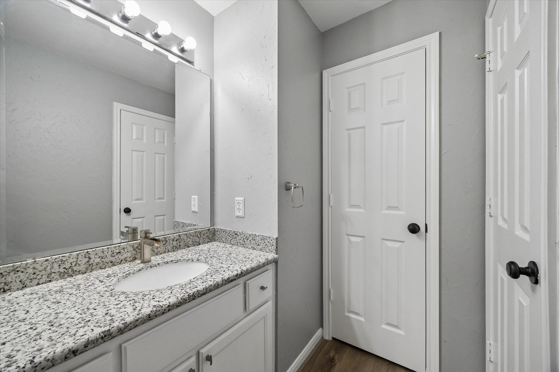 The thoughtfully designed Jack-and-Jill bathroom provides convenient shared access between the secondary bedrooms and features a tub/shower combination, making it ideal for family and guests.