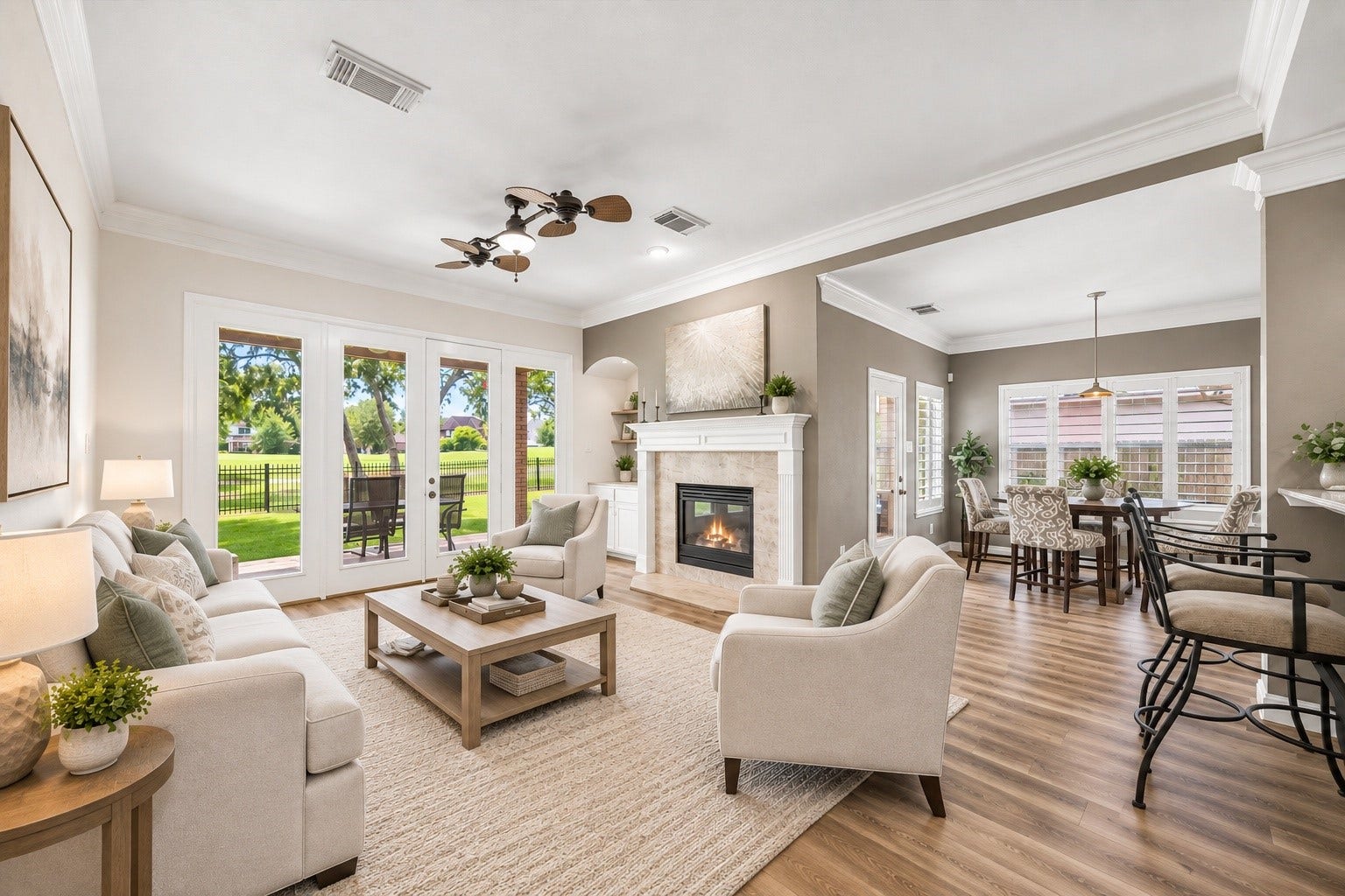 Virtually staged living room highlights the spacious layout, natural light, and beautiful views through the wall of windows.
