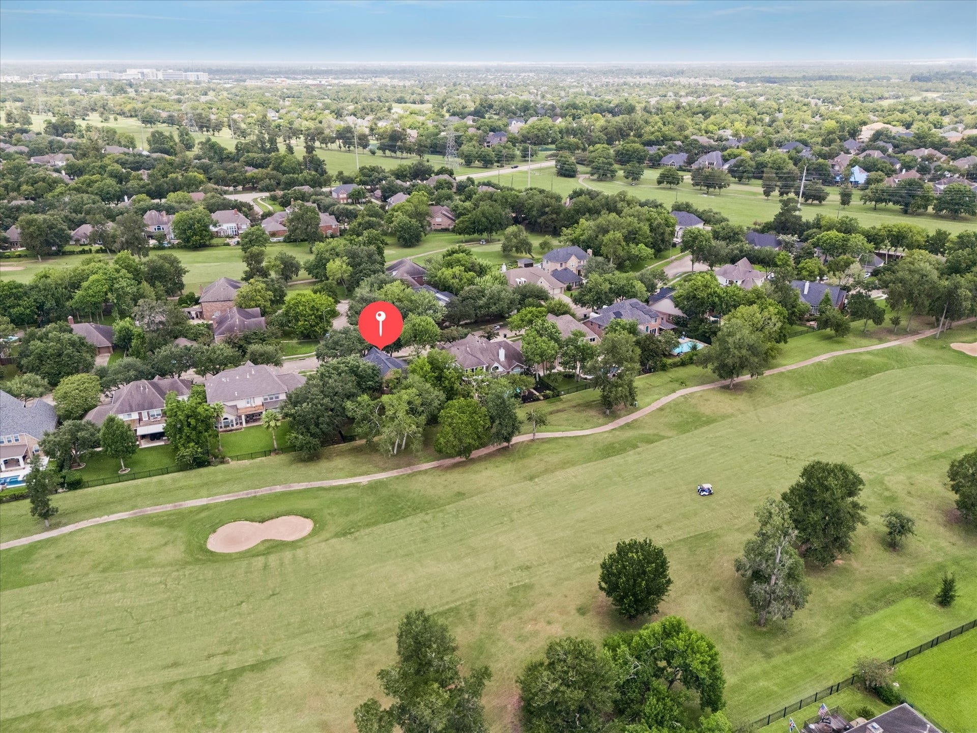 Aerial view showcasing the home's premier location overlooking the Greatwood Golf Course.