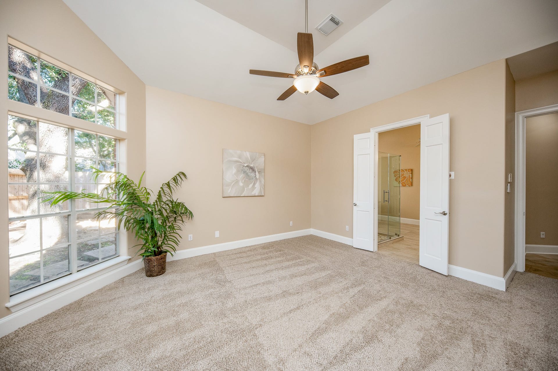 23014 Laguna Point Drive, Katy, TX 77450 The ensuite bath, behind double doors, right, is just footsteps from your luxurious primary suite.