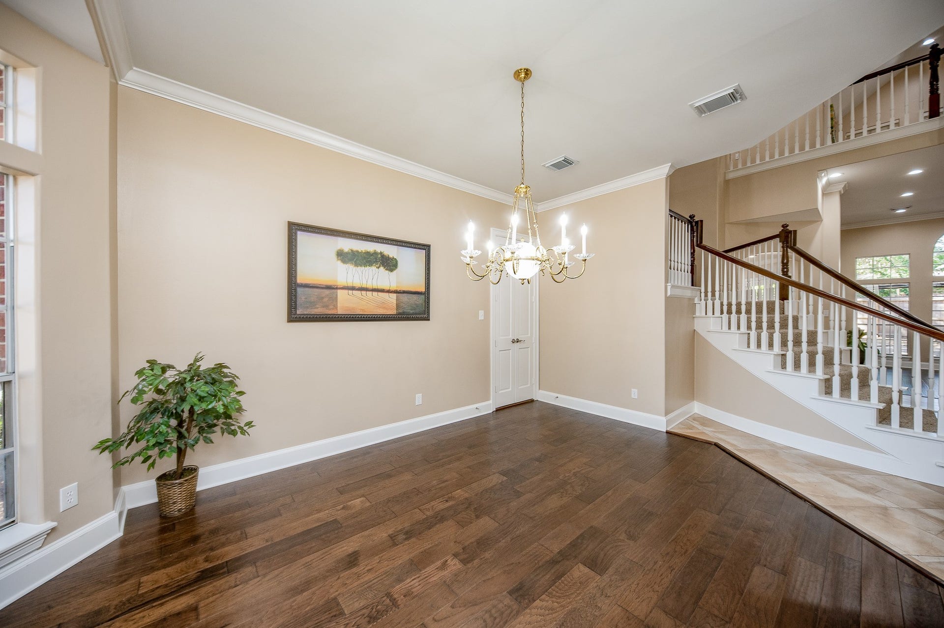 23014 Laguna Point Drive, Katy, TX 77450 This warm interior view of the formal dining area offers just enough privacy and a pleasant visual connection to hallway and staircase.