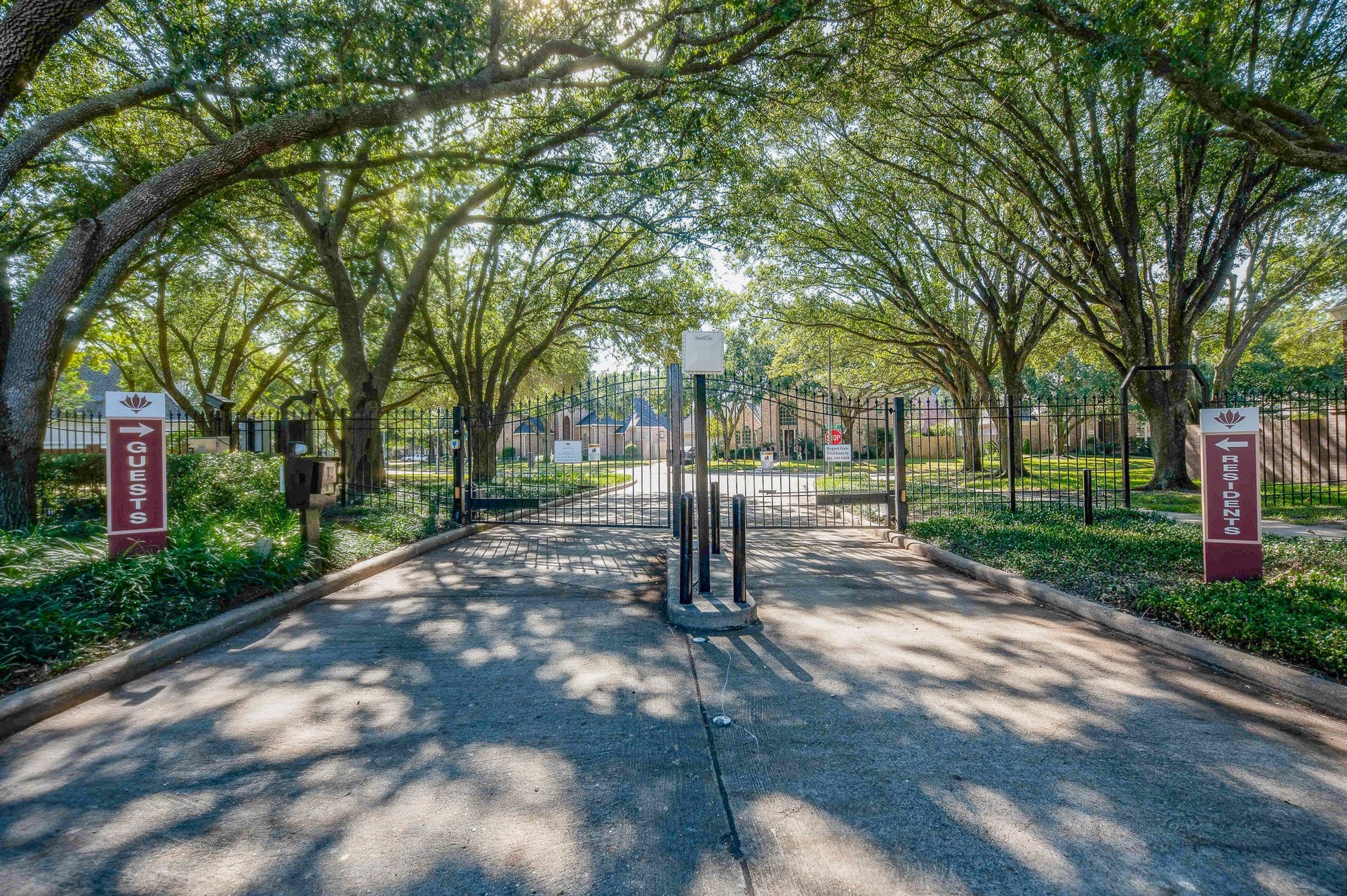 23014 Laguna Point Drive, Katy, TX 77450 Natural tree branches add to the security of the gated community.