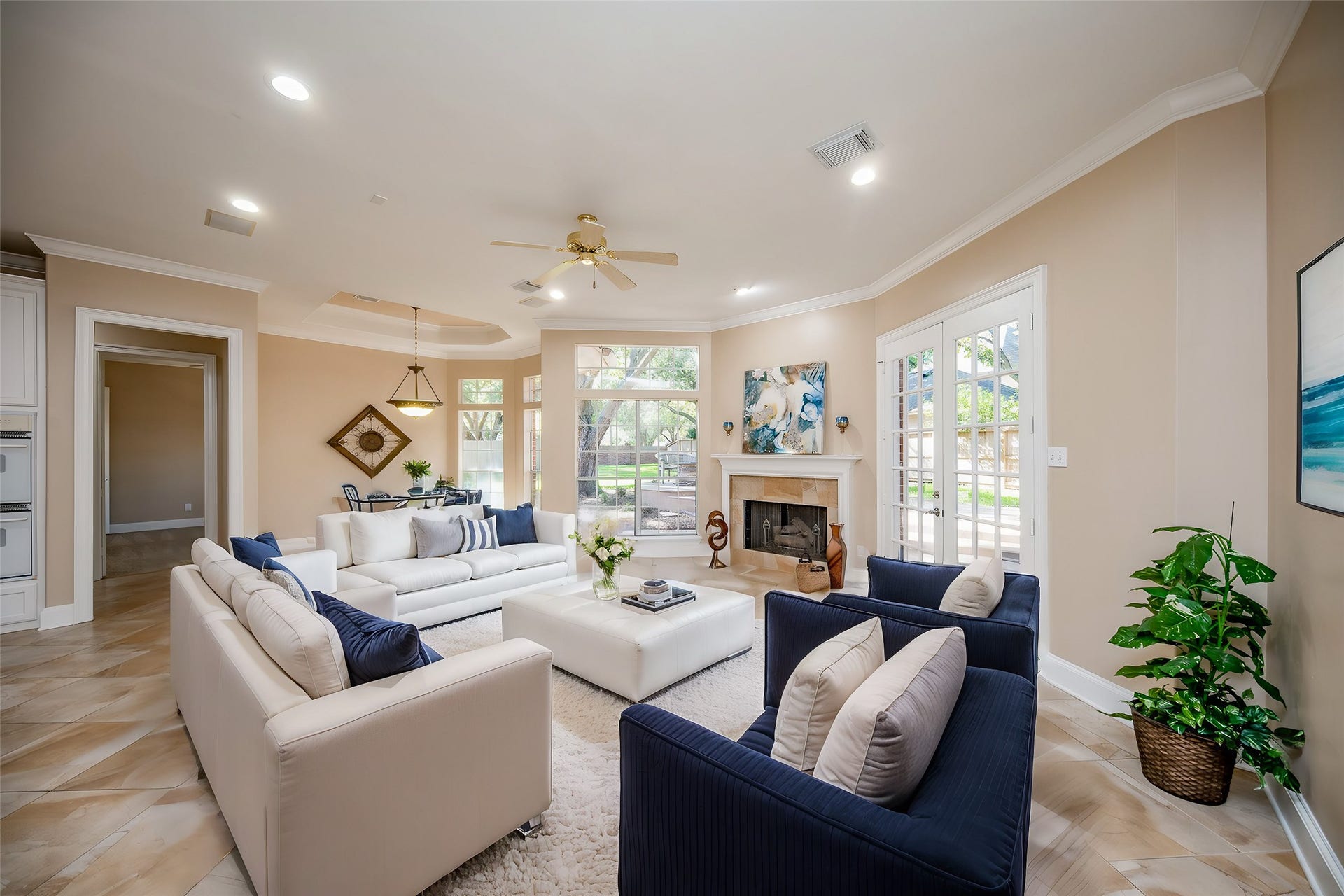 23014 Laguna Point Drive, Katy, TX 77450 This jewel box of a living area magically invites family and friends with luscious tile flooring, high ceiling, lots of natural light and a corner fireplace, as the star of the show!