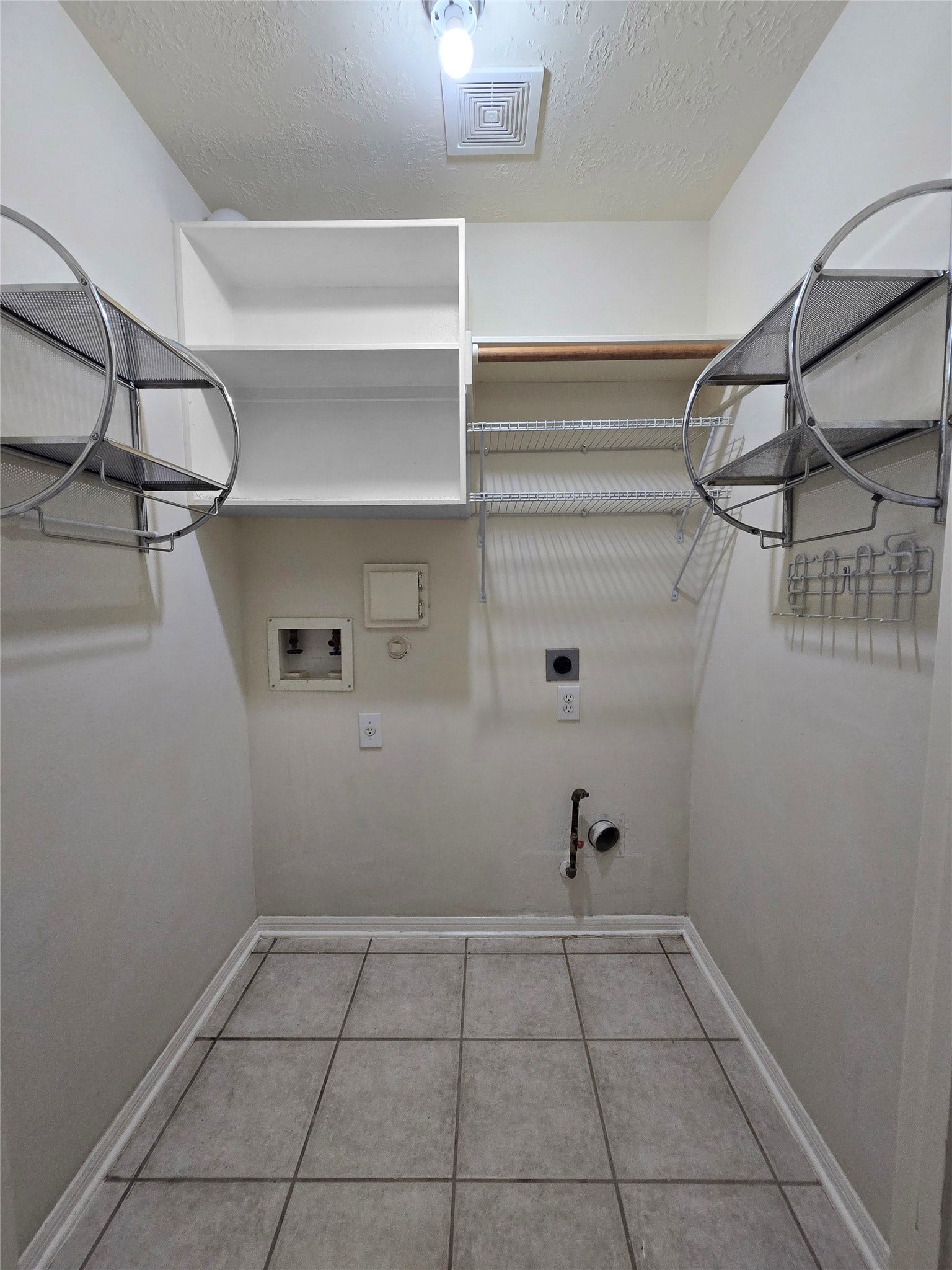 Laundry room with added shelving racks