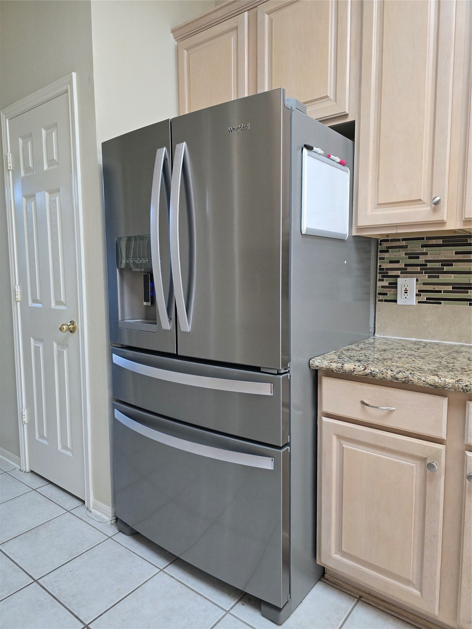 French door refrigerator with water dispenser and ice maker included with the sale of the house.