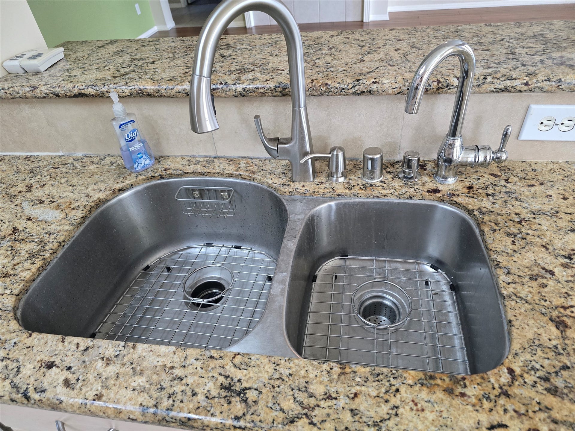 Large double sink with stainless racks.  Secondary faucet already hooked up for additional water source for water filter machines or as a spare faucet.