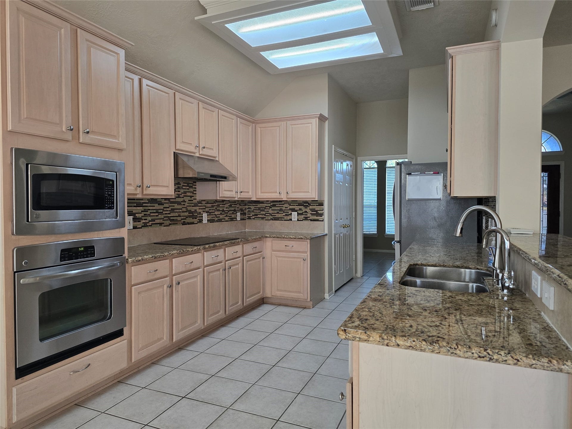 Large kitchen with plenty of cabinetry for storage.