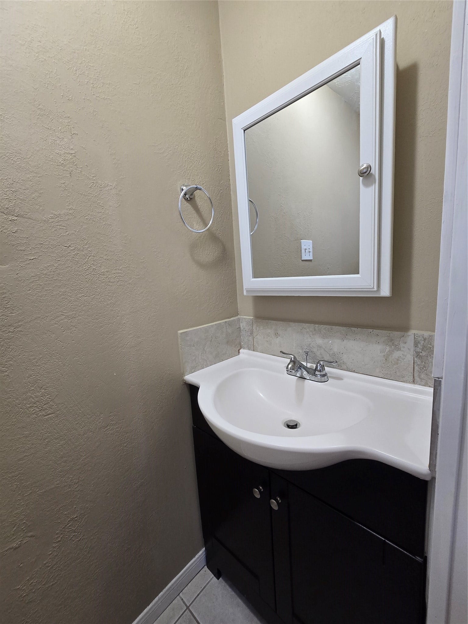 Cute little vanity cabinet with a mirrored wall medicine cabinet