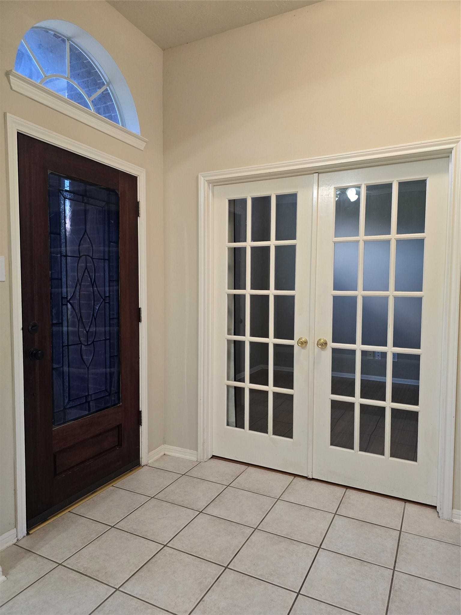 Front Entry area with French doors to Home Office/Study that can be used as a 4th bedroom if needed since it has a closet.