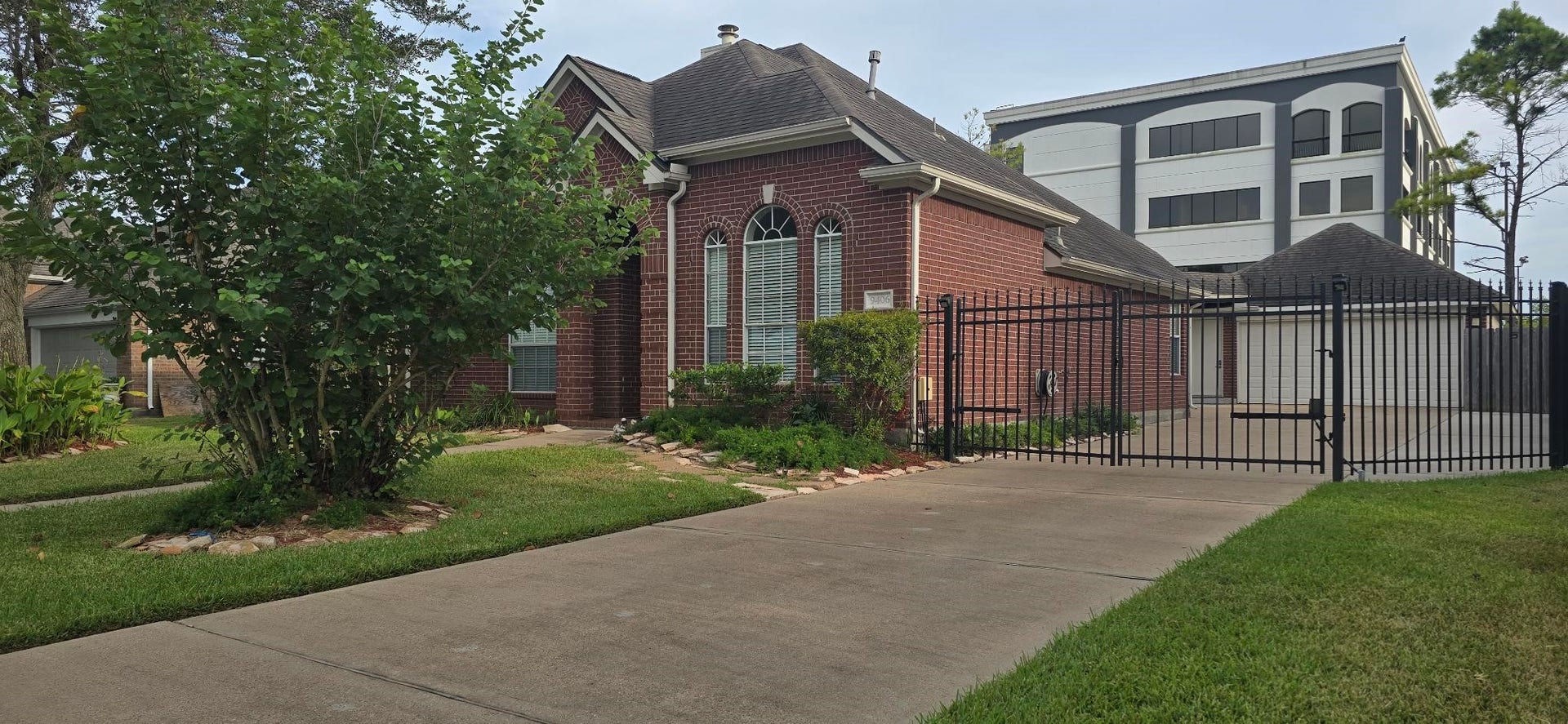 Long driveway with Auto Gate and detached 2 car garage