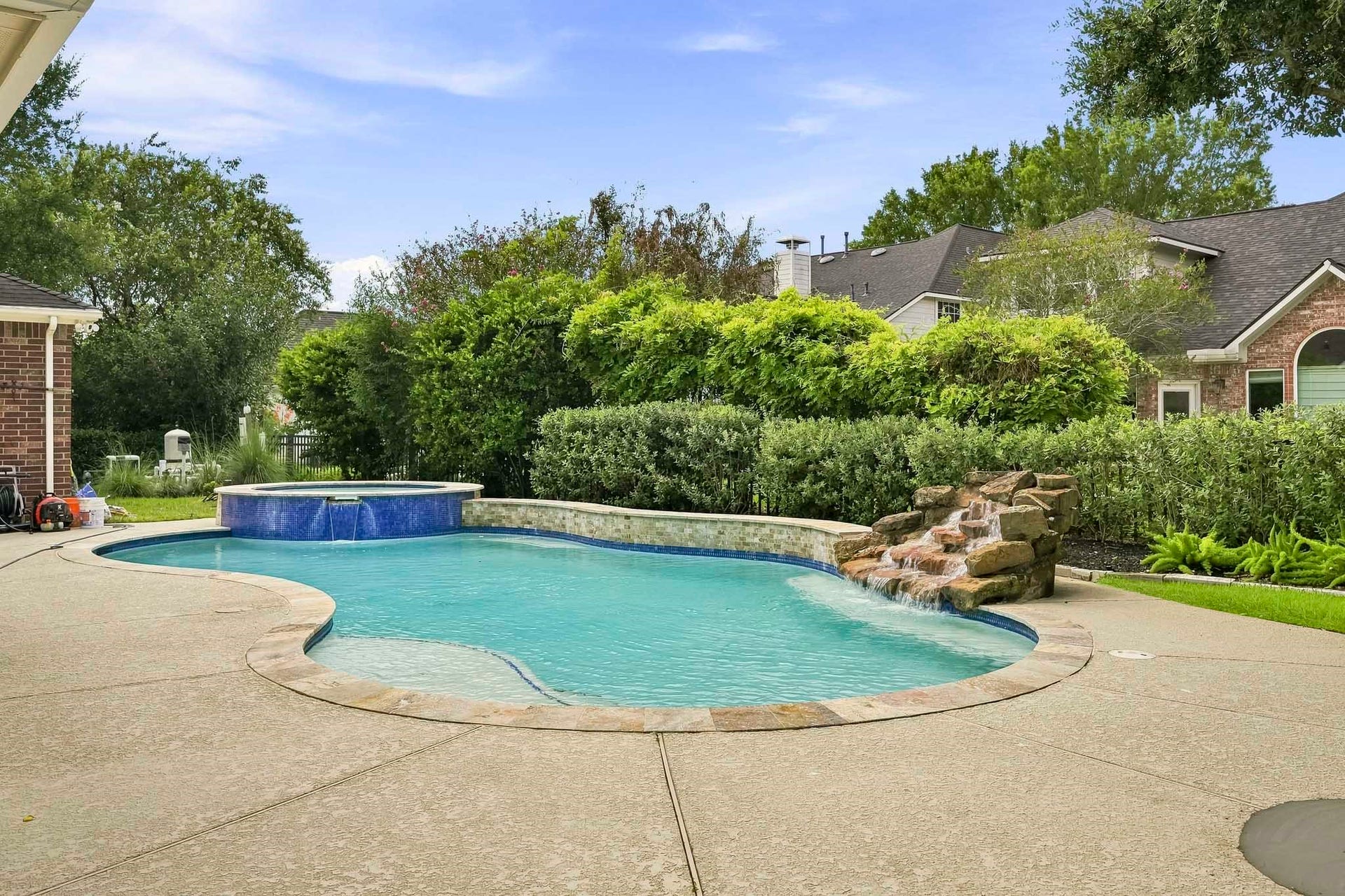 5702 Misty Island Court, Katy, TX 77494 Beautiful pool with oversized spa and waterfall.