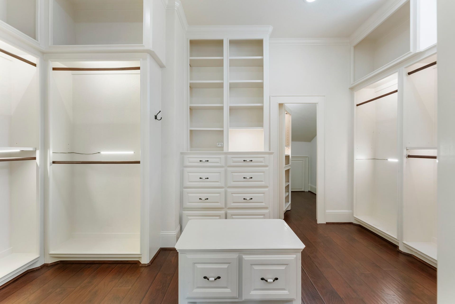 27507 Hunter Creek Court, Spring, TX 77386 Spacious primary closet with custom built-ins, drawers, shelving and multiple hanging areas.