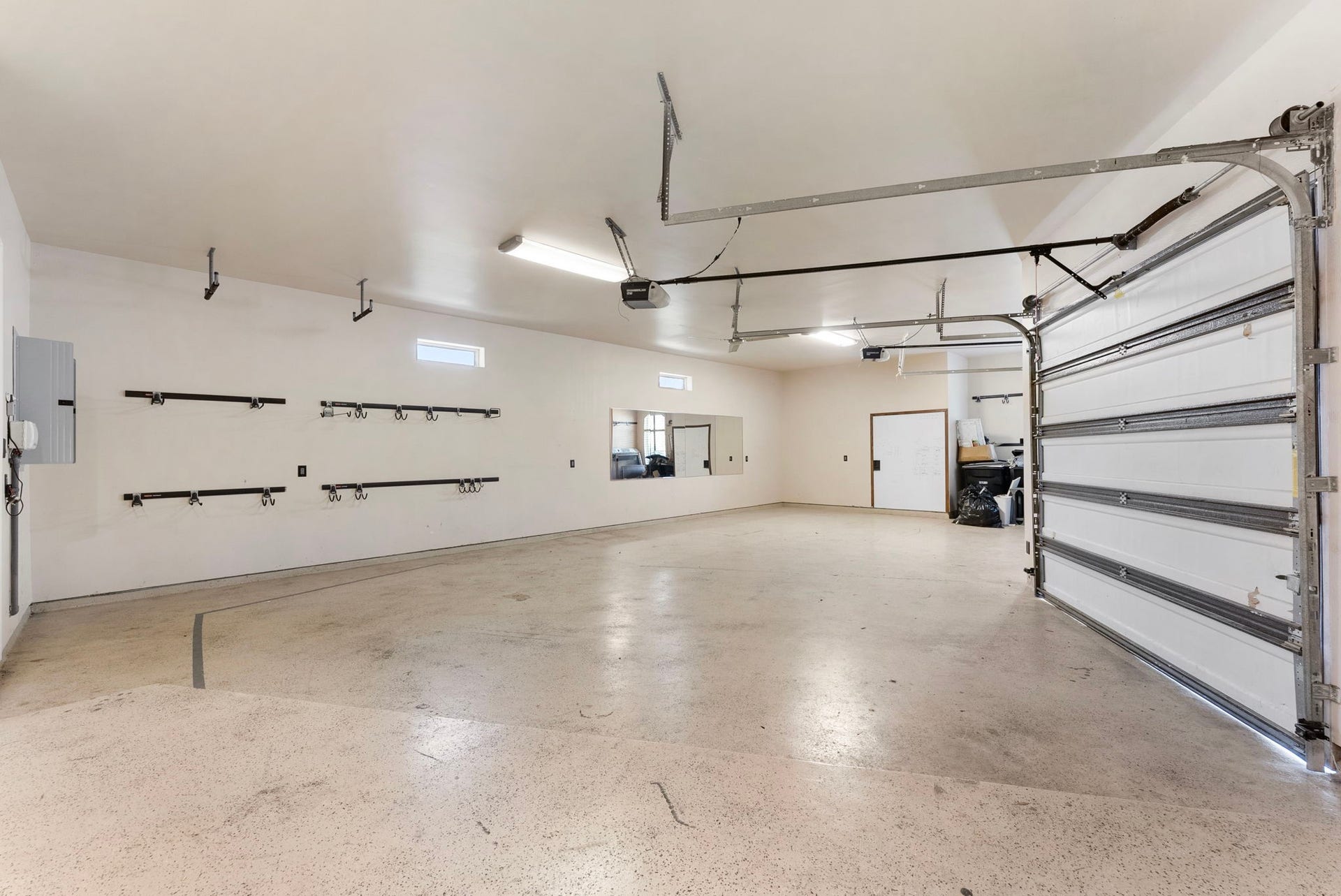 27507 Hunter Creek Court, Spring, TX 77386 Oversized attached garage with multiple bays, finished flooring and extensive wall-mounted storage space.