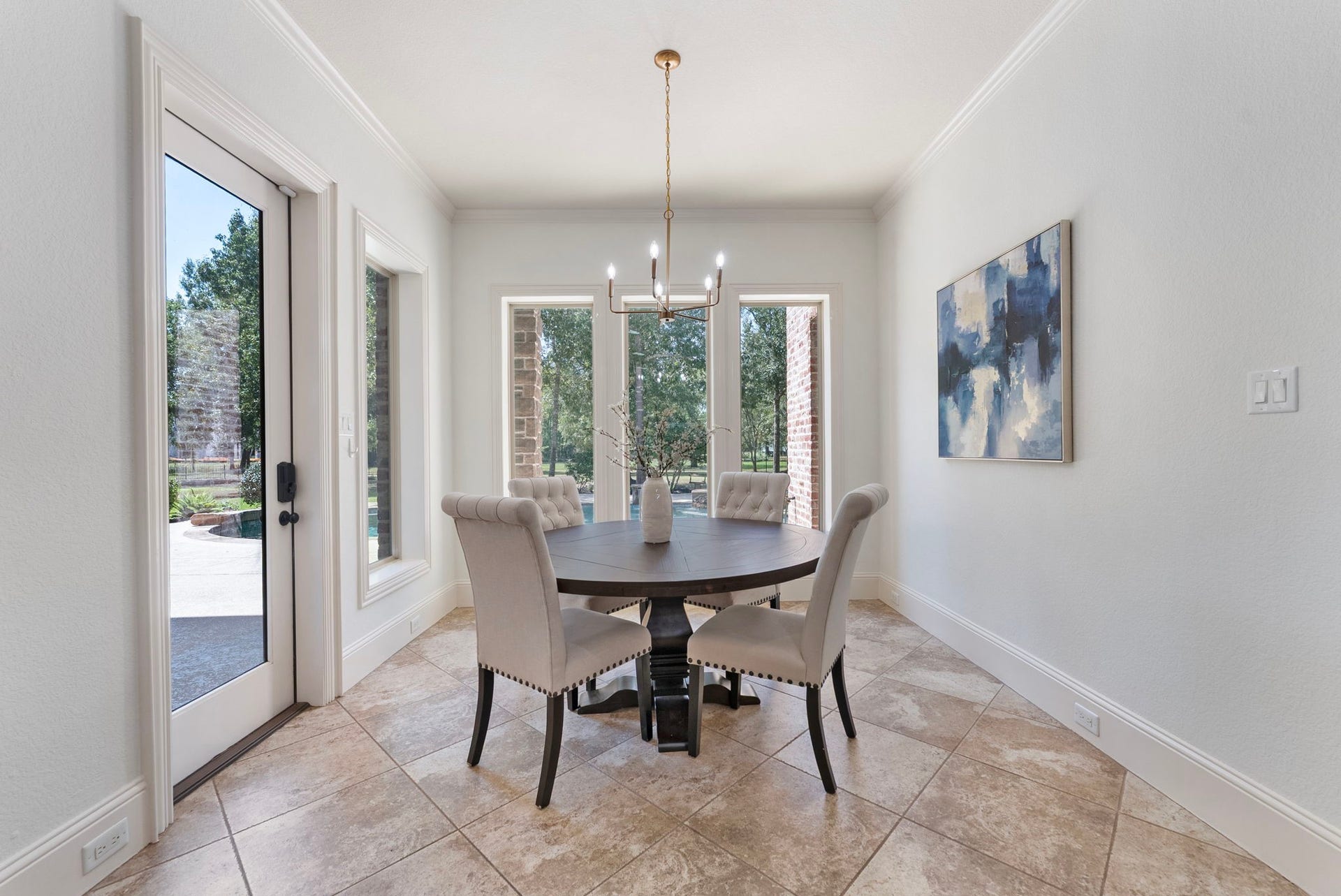 27507 Hunter Creek Court, Spring, TX 77386 Breakfast area surrounded by windows with direct access to the covered patio and pool area.