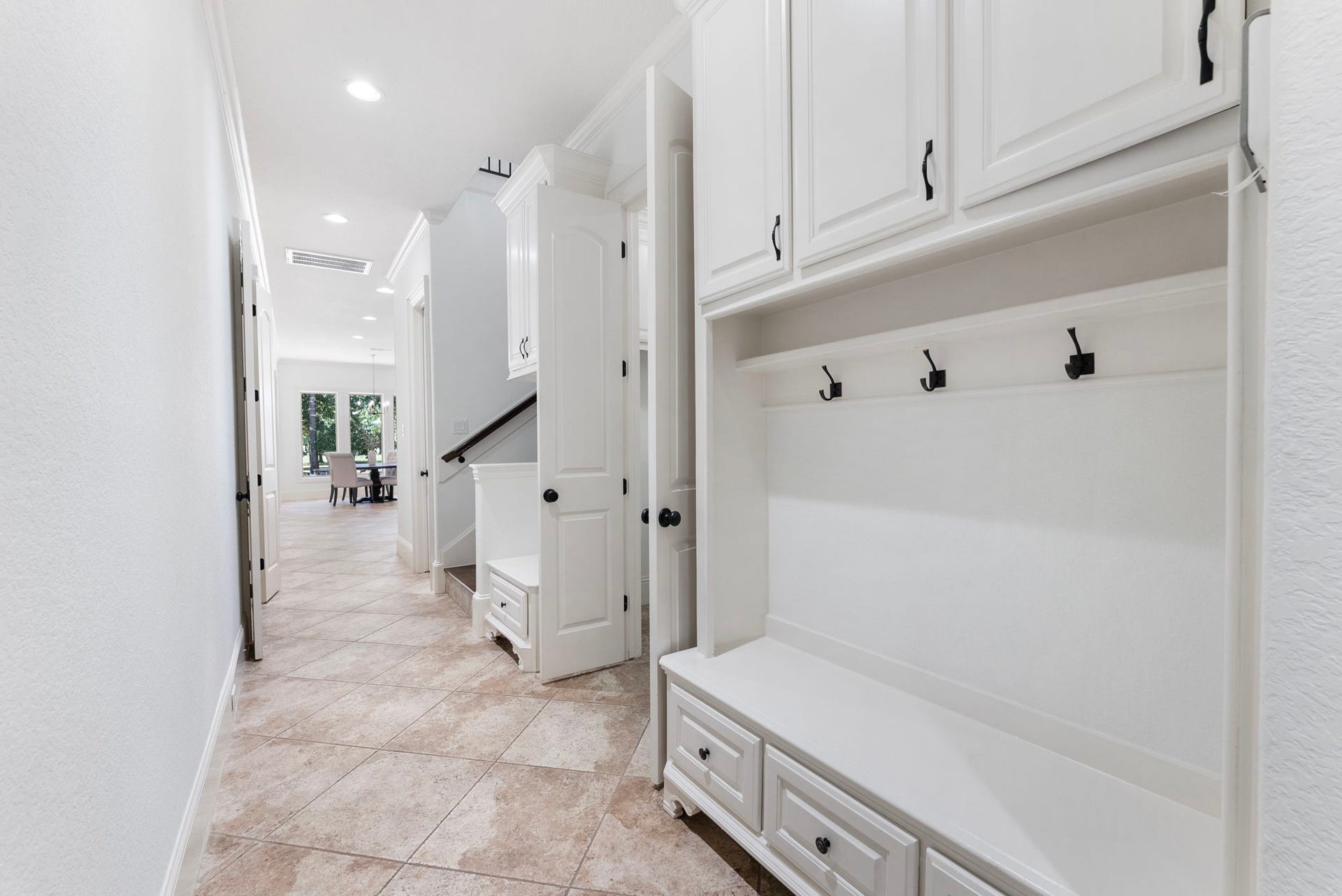 27507 Hunter Creek Court, Spring, TX 77386 Built-in mudroom/drop zone with bench seating, storage cabinets, drawers and wall hooks.