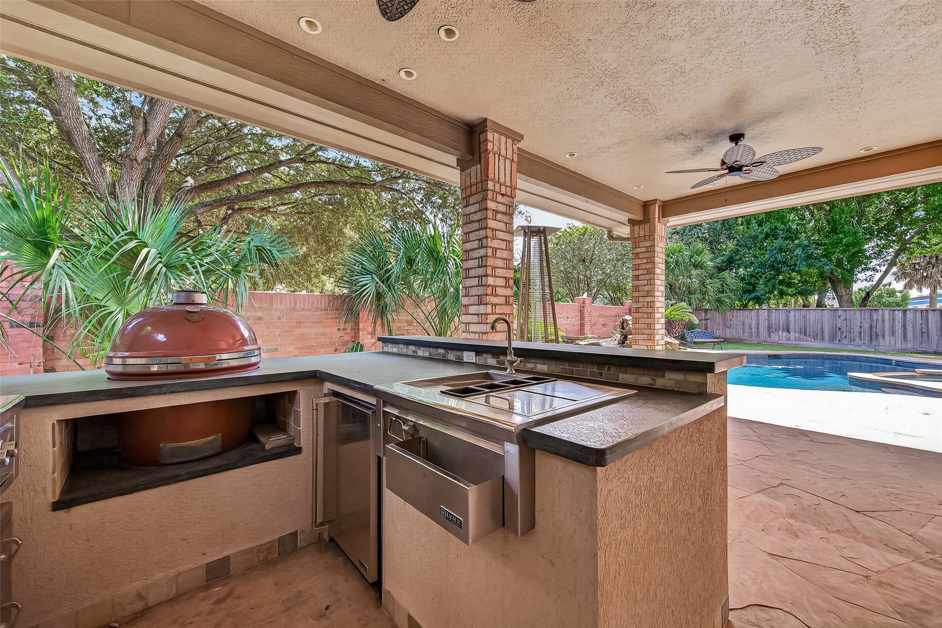 63 Harbor View Drive, Sugar Land, TX 77479 Amazing outdoor kitchen complete with a grill, smoker, wok burner, sink, and beverage fridge!