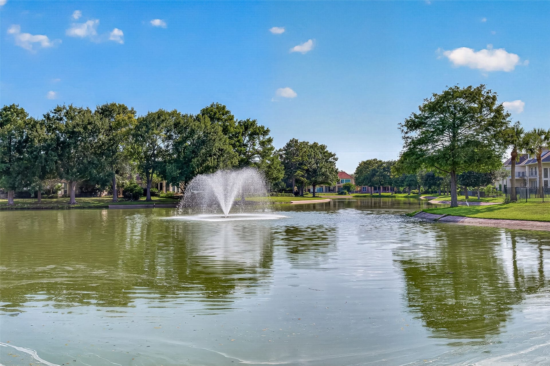 63 Harbor View Drive, Sugar Land, TX 77479 Serene lake view with a central fountain welcomes you as you enter the gates of Pointe Royale