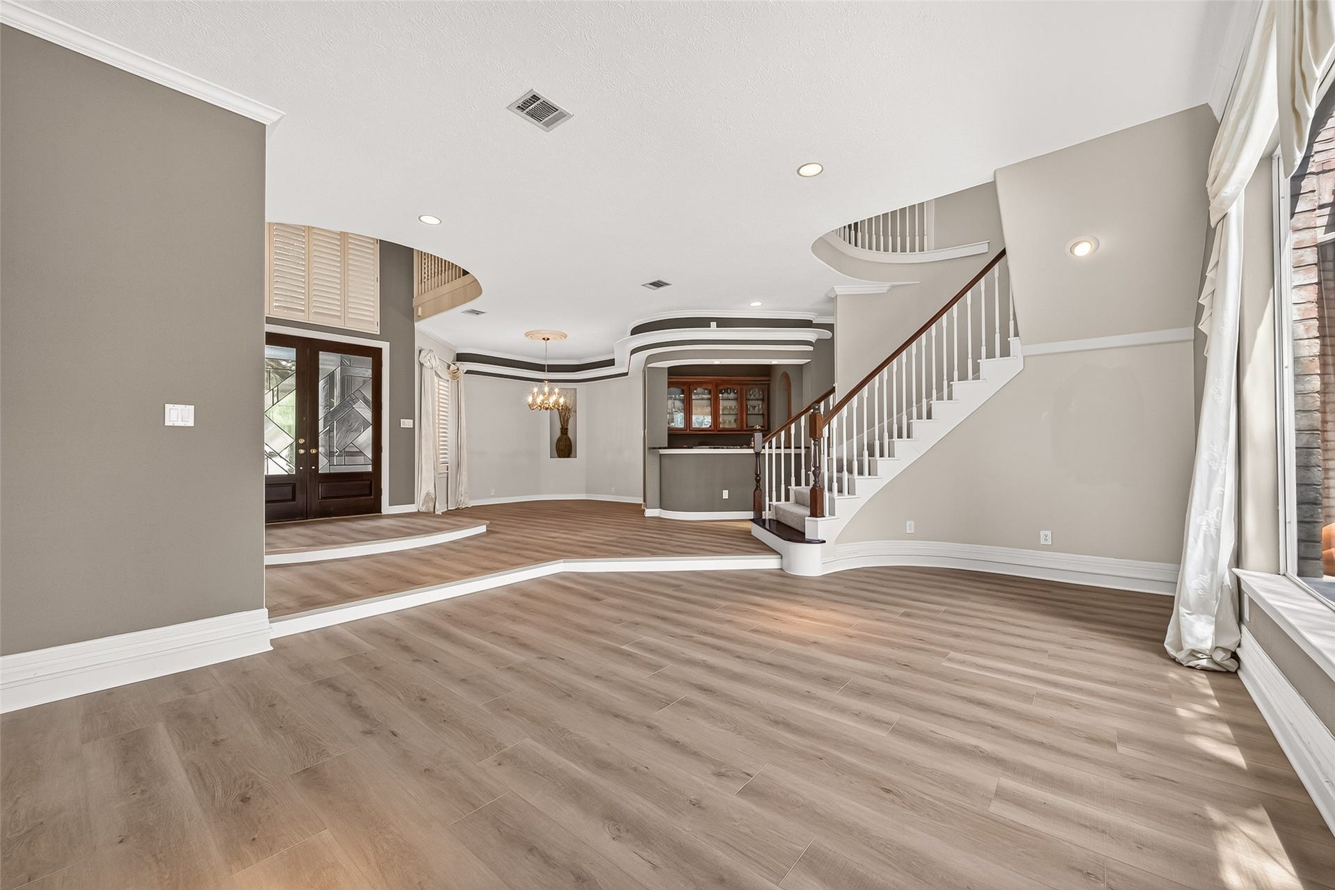 63 Harbor View Drive, Sugar Land, TX 77479 Another look at this amazing entryway with a seamless flow of the formal dining, sitting area, and wet bar for you to entertain effortlessly.