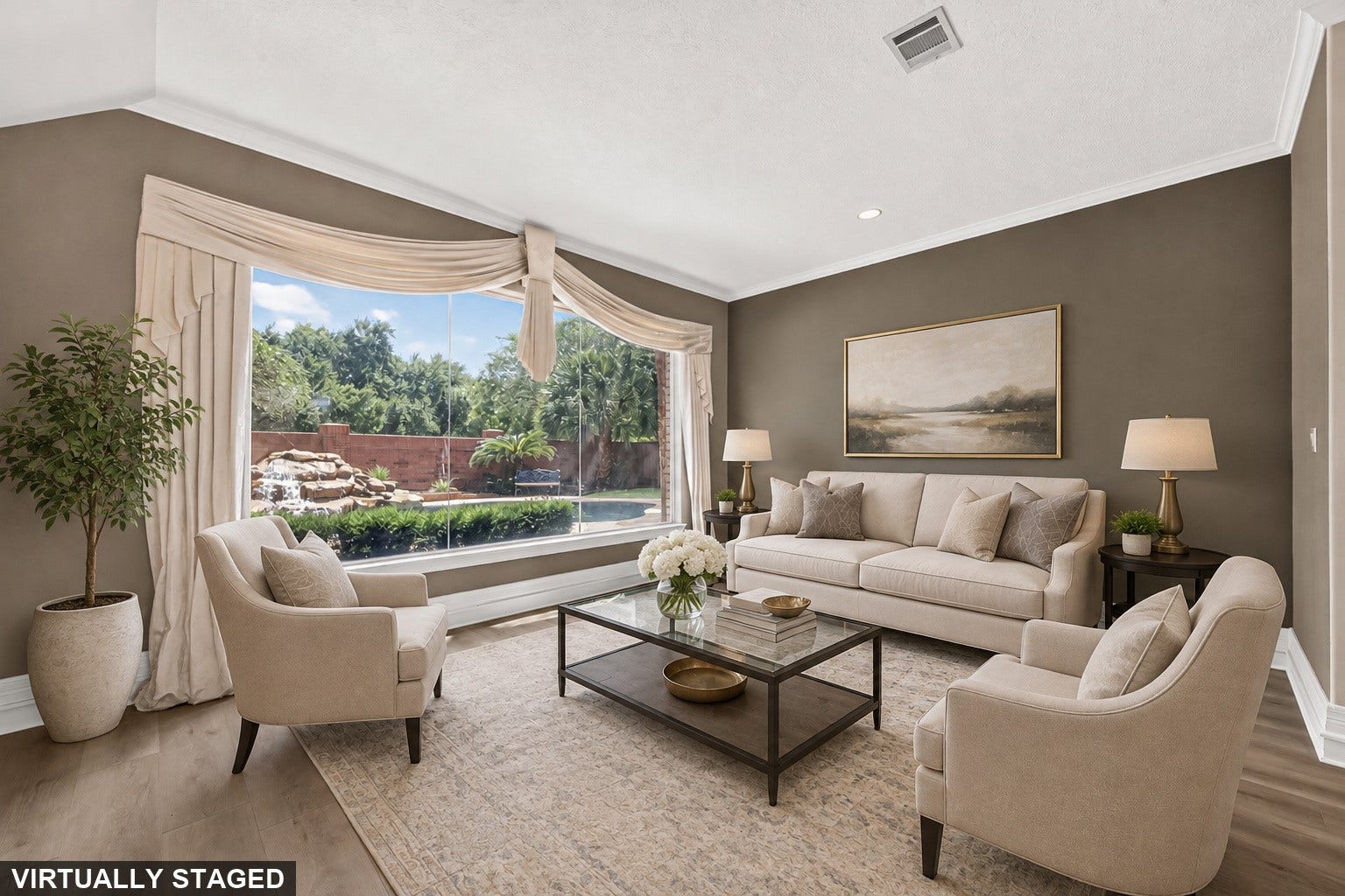 63 Harbor View Drive, Sugar Land, TX 77479 Virtually staged sitting area with beautiful view of backyard pool/spa with waterfall feature