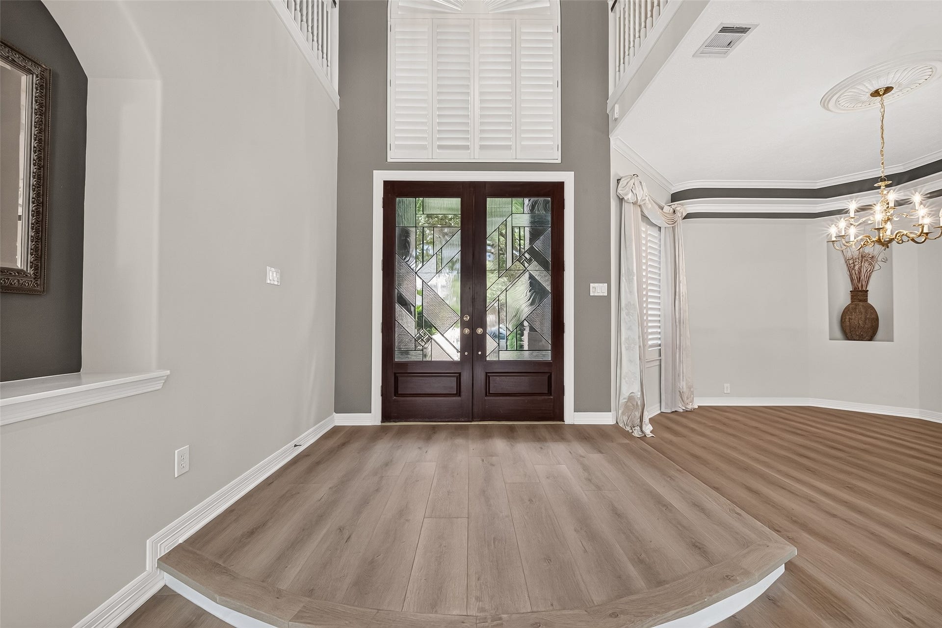 63 Harbor View Drive, Sugar Land, TX 77479 Soaring ceilings and large windows bring in an abundance of natural light into this beautiful home.