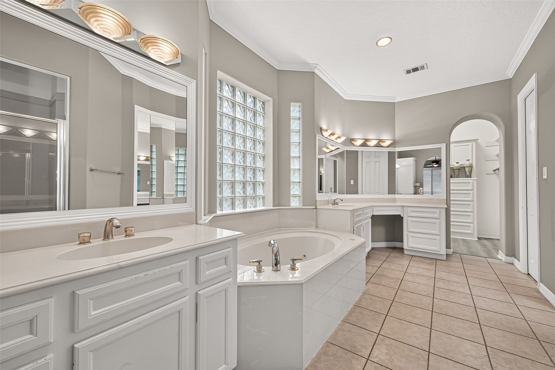 63 Harbor View Drive, Sugar Land, TX 77479 Spacious owner's bathroom featuring a soaking tub, dual vanities, double shower and two separate closets!