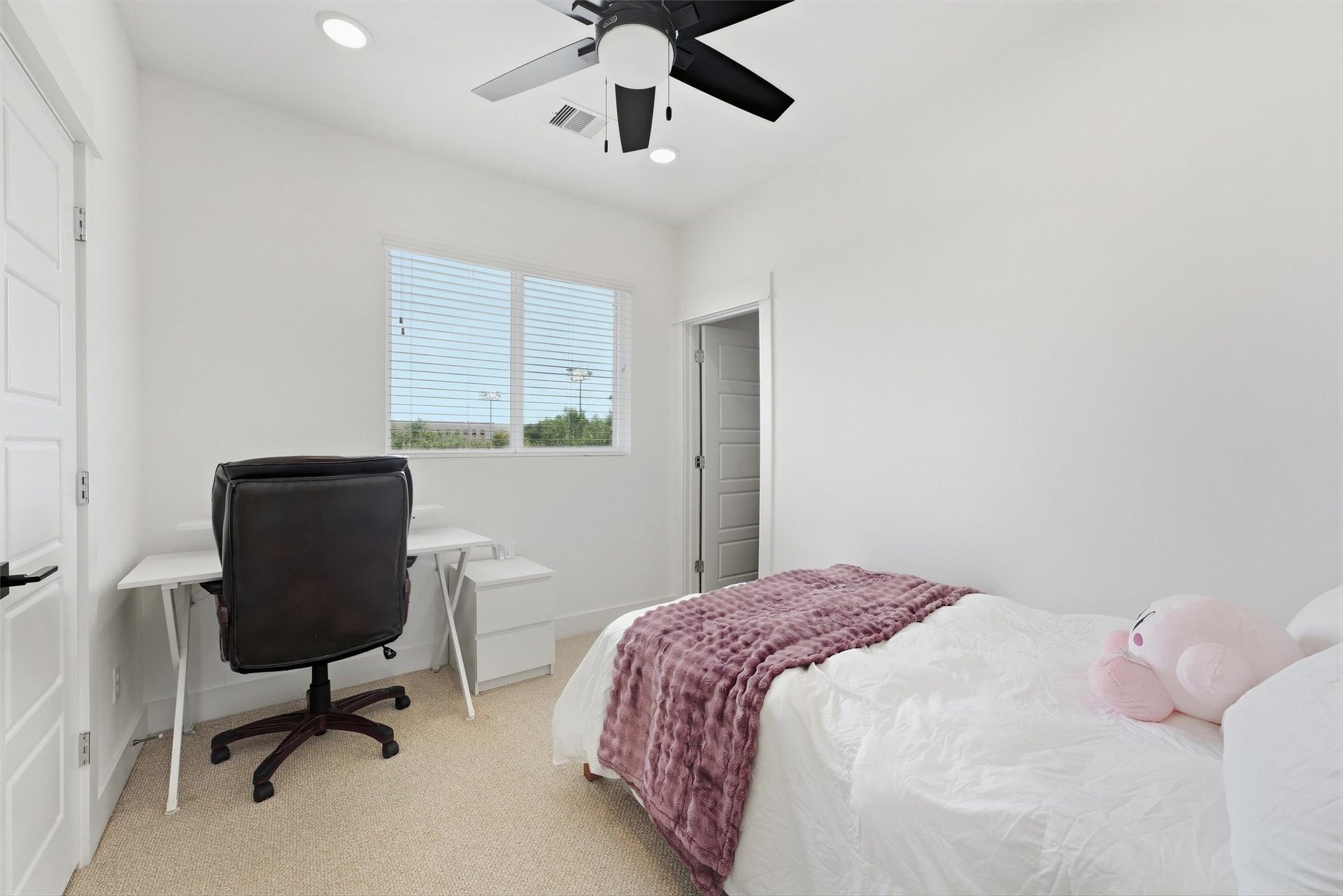 Third-floor bedroom with en suite bath.