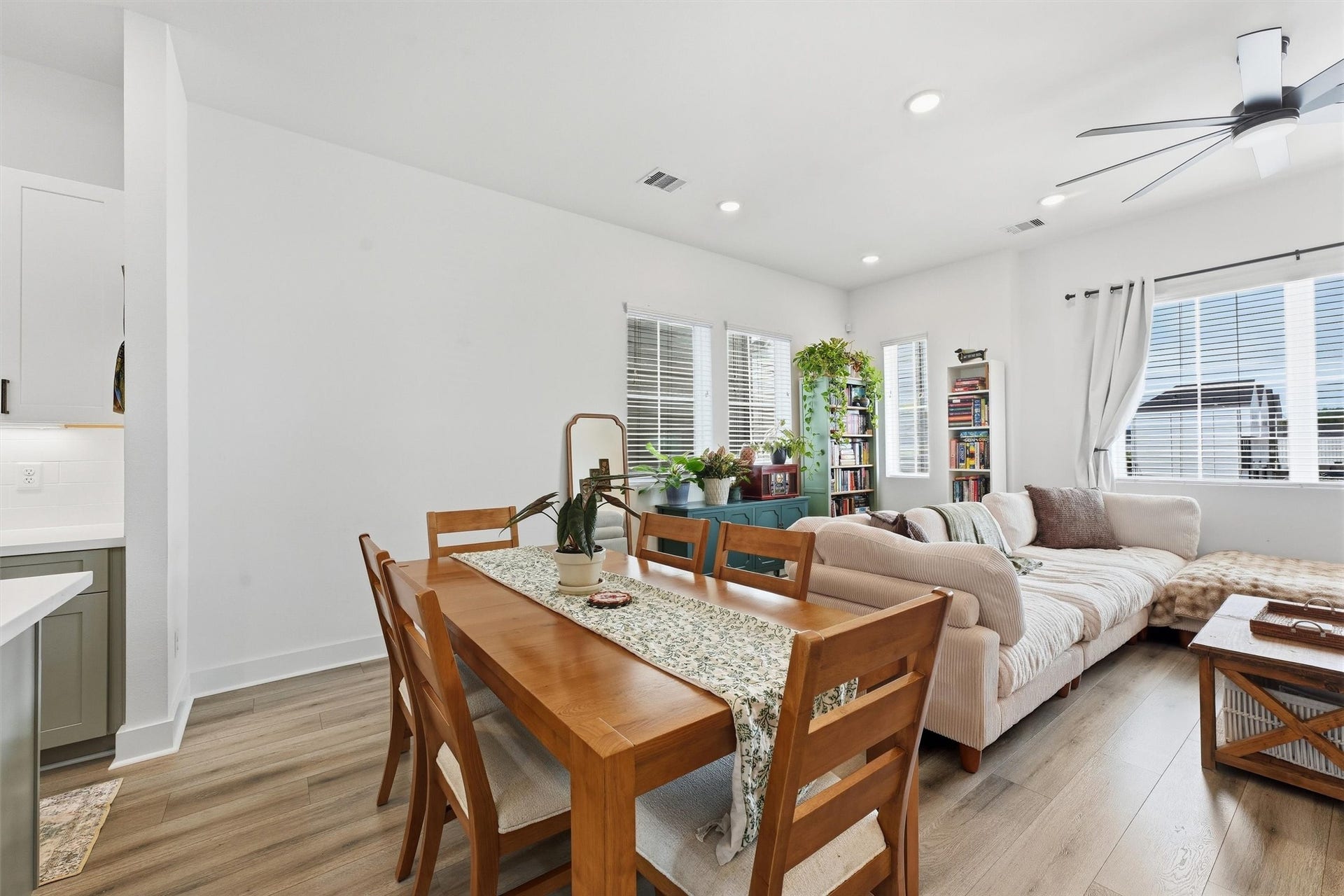Sun-filled living and dining area with abundant natural light throughout.