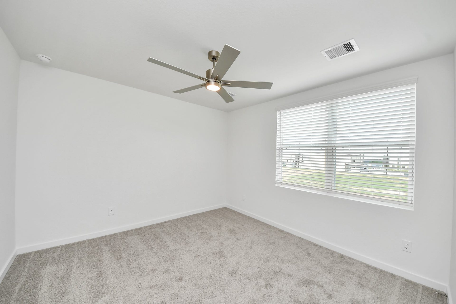 5814 Madison Trail Drive, Richmond, TX 77469 Secondary bedroom features plush carpeting, large windows that let in plenty of natural light, bright paint, and spacious closets. Sample photo of completed home with similar floor plan. Actual colors and selections may vary.