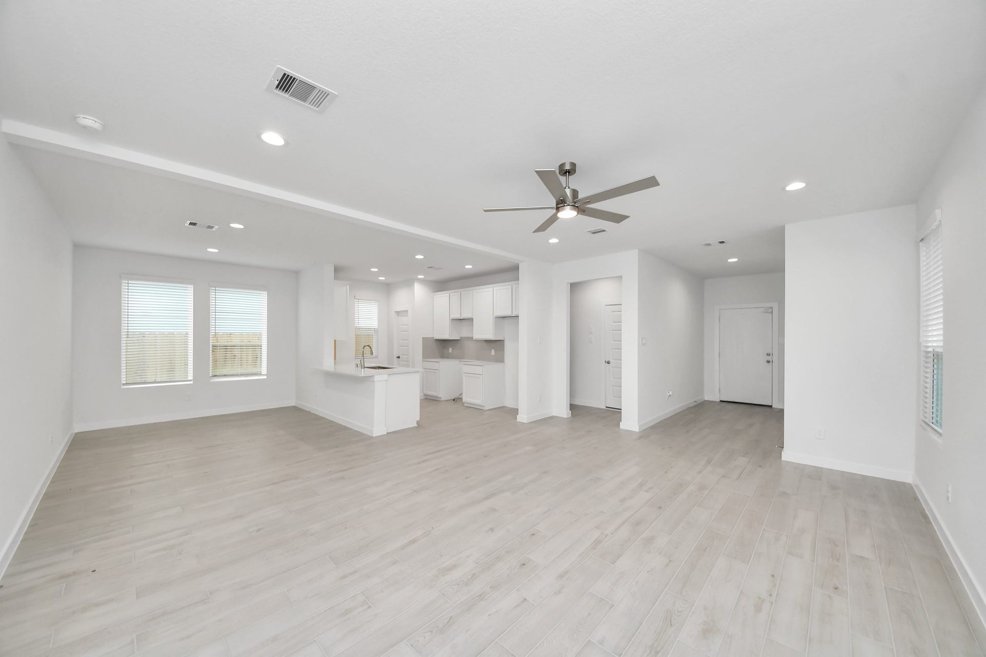 5814 Madison Trail Drive, Richmond, TX 77469 Gather the family and guests together in your lovely living room! Featuring soaring high ceilings, recessed lighting, ceiling fan, custom paint, gorgeous floors, and large windows that provide plenty of natural lighting throughout the day. Sample photo of completed home with similar floor plan. Actual colors and selections may vary.