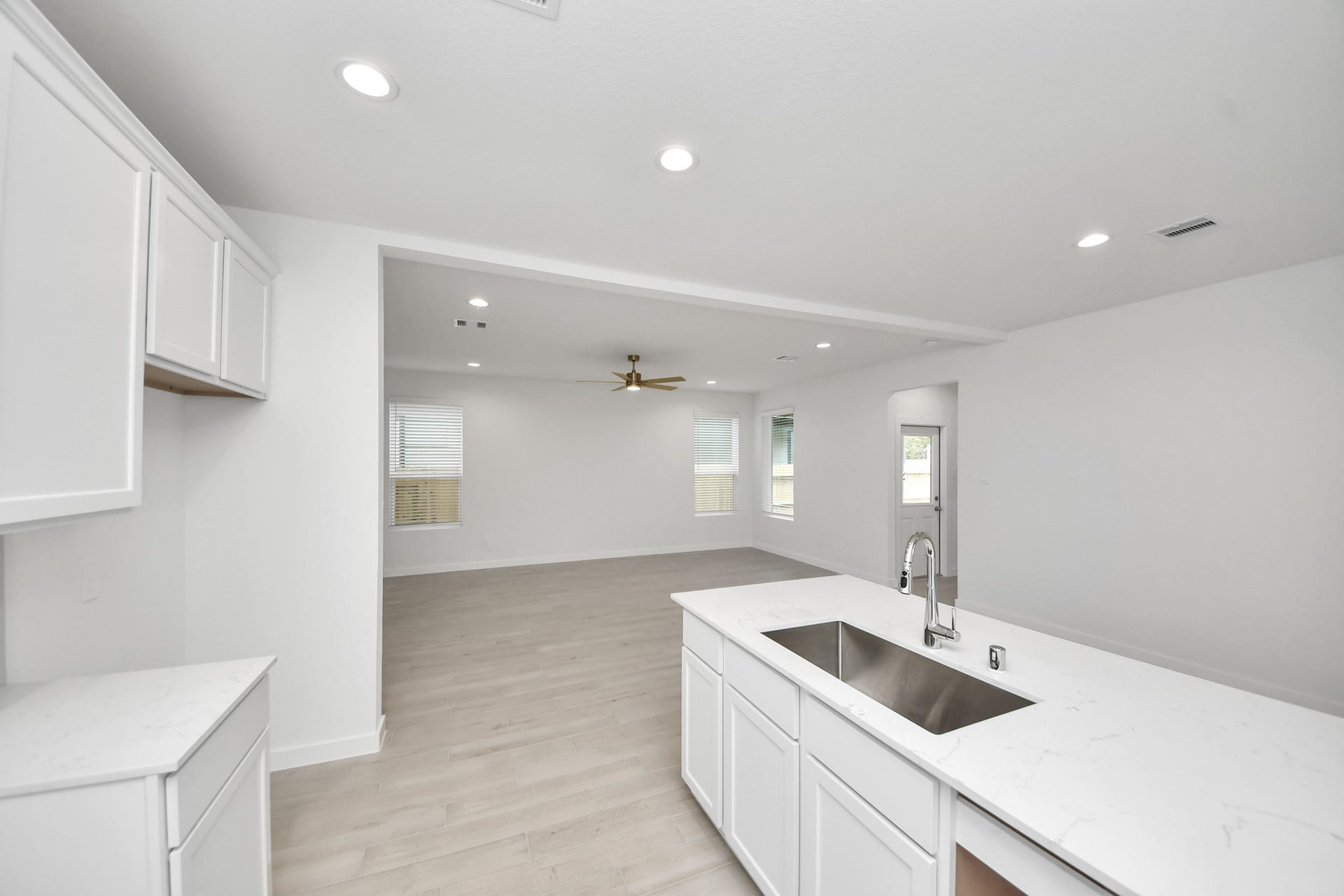 5814 Madison Trail Drive, Richmond, TX 77469 Discover another perspective of this stunning kitchen, generously appointed with an abundance of counter space. Sample photo of completed home with similar floor plan. Actual colors and selections may vary.