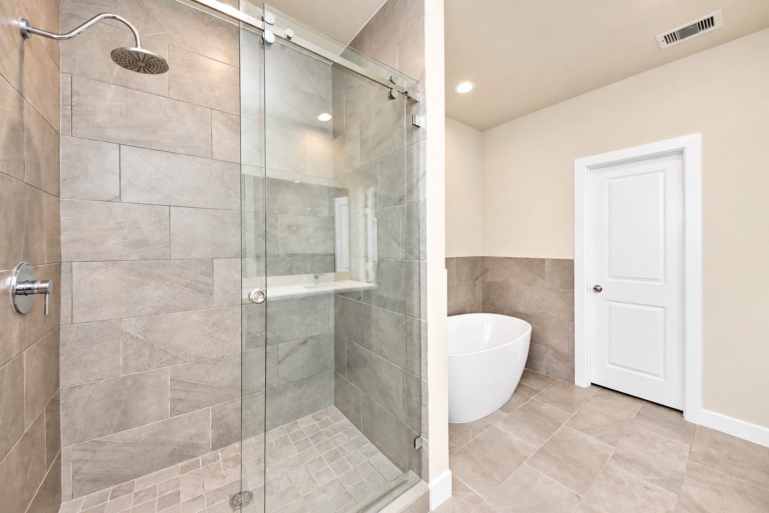 5908 Jasper Jones Way, Houston, TX 77091 Primary bathroom with glass shower and free-standing tub.