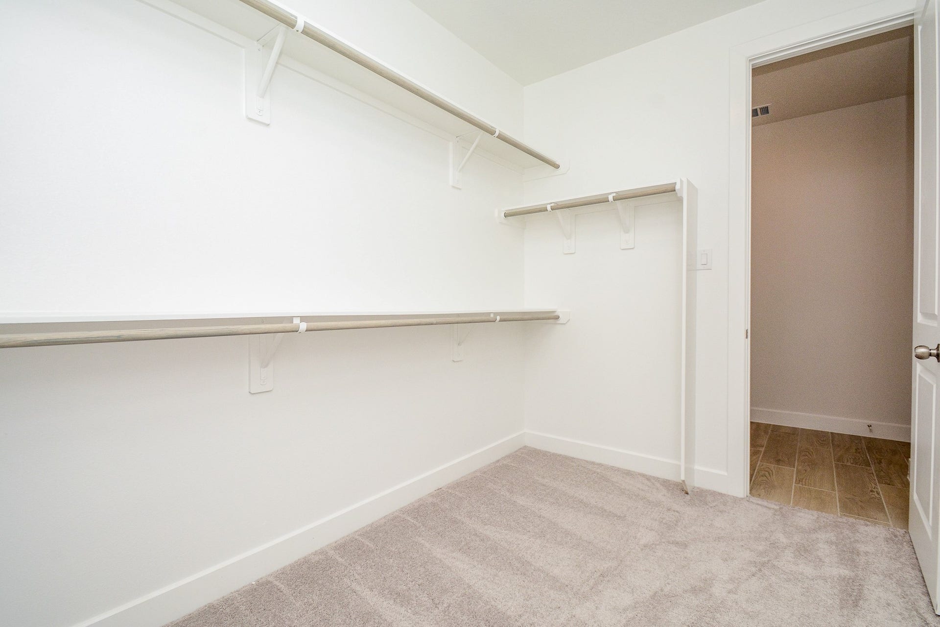 Large walk-in closet with built-in shelving