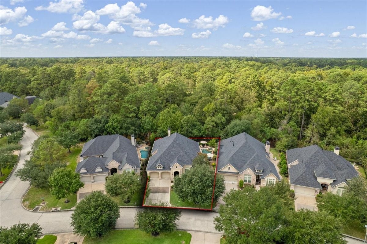 5530 Regal Landing Drive, Kingwood, TX 77345 Backing to a wooded reserve provides extra privacy in the backyard.