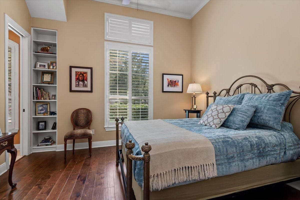 5530 Regal Landing Drive, Kingwood, TX 77345 Bedroom #2 also has hardwood floors and a handy built-in bookshelf.