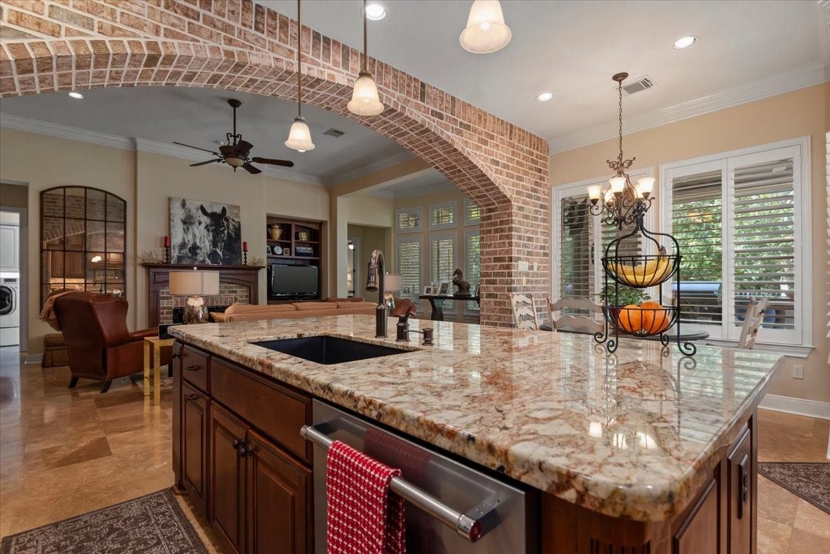 5530 Regal Landing Drive, Kingwood, TX 77345 And the brick archway is breathtaking!