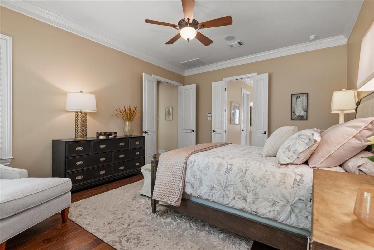 5530 Regal Landing Drive, Kingwood, TX 77345 The primary bedroom has neutral walls and hardwood floors.