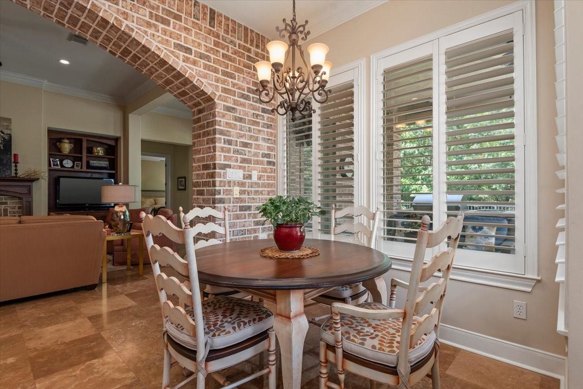 5530 Regal Landing Drive, Kingwood, TX 77345 Plantation shutters dress the windows in the breakfast room, living room and bedrooms.