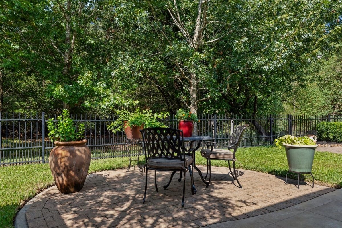 5530 Regal Landing Drive, Kingwood, TX 77345 Intimate and peaceful brick paver patio to enjoy the wooded reserve.