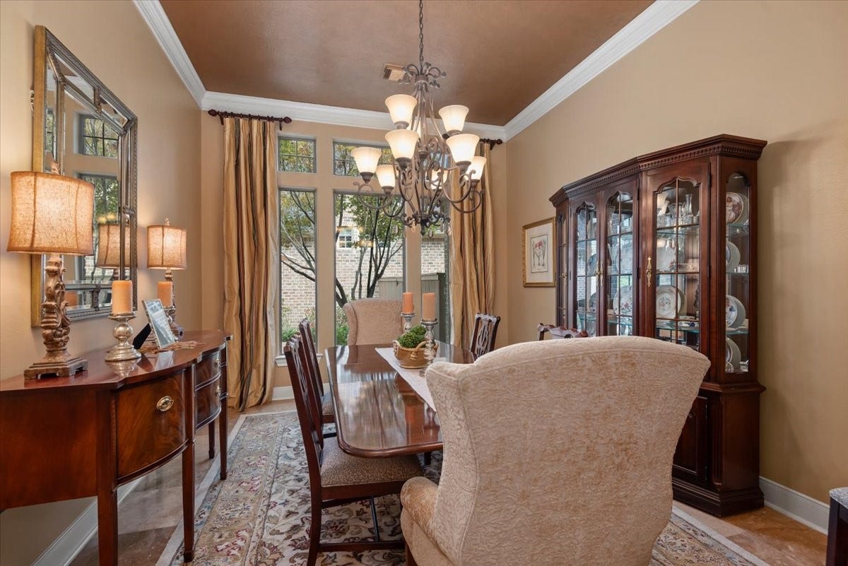 5530 Regal Landing Drive, Kingwood, TX 77345 The dining room features an exquisite view of the side patio, pool and landscape.