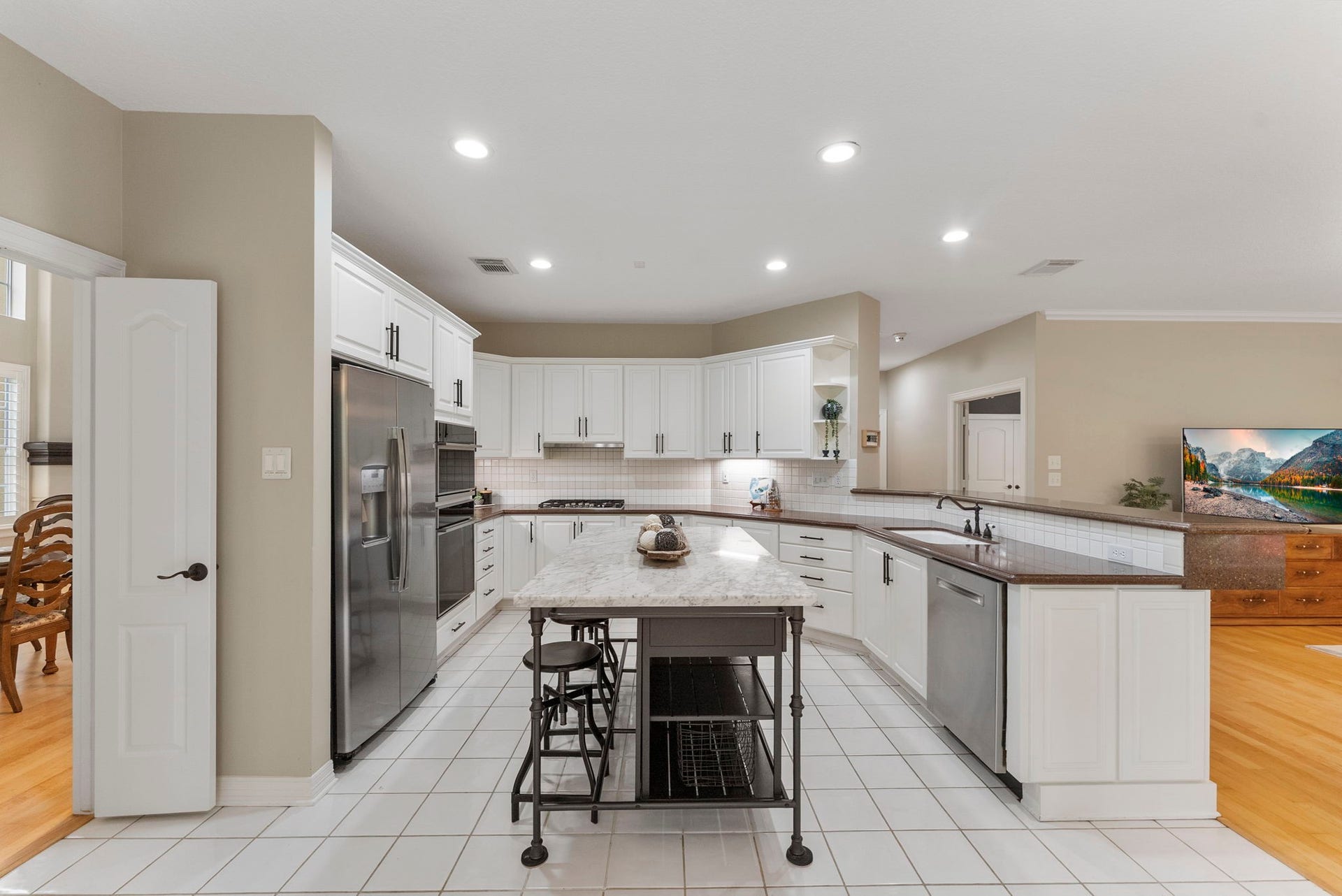 The Kitchen Refrigerator conveys with the home.