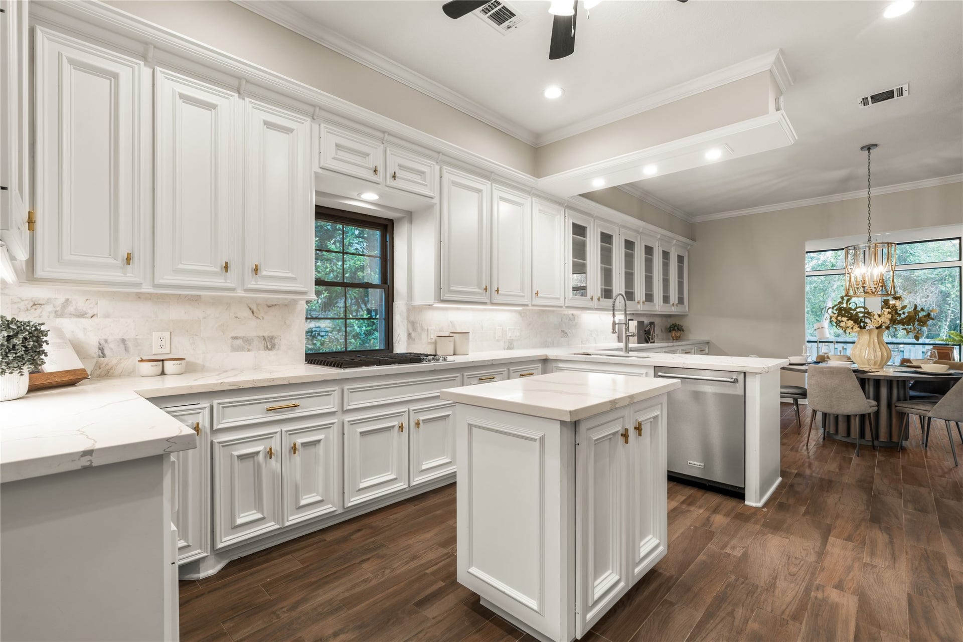 4719 Breezy Point Drive, Houston, TX 77345 The kitchen flows seamlessly into the breakfast area, combining elegant finishes with an open layout ideal for gathering.