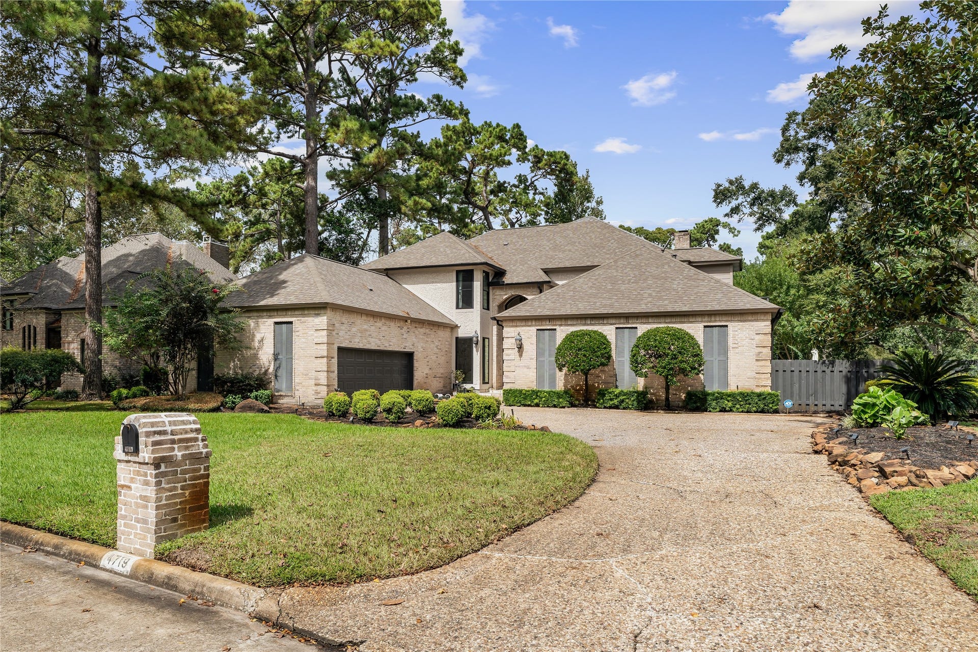 4719 Breezy Point Drive, Houston, TX 77345 Exceptional curb appeal welcomes you home, with a sweeping driveway, stately brick faade, and the added privacy of having neighbors on only one side.