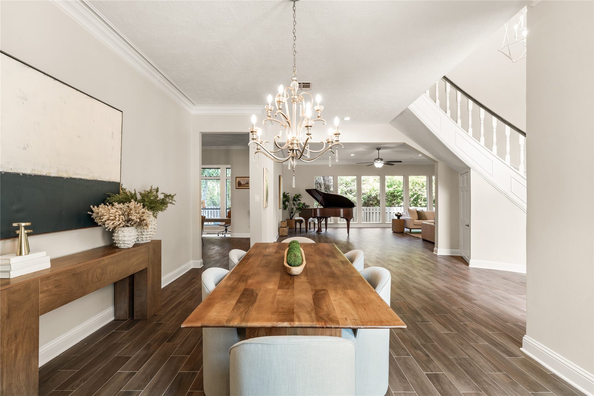 4719 Breezy Point Drive, Houston, TX 77345 Gracious proportions and refined architectural details create an elegant transition from the formal dining room into the expansive living space, perfectly suited for sophisticated entertaining.
