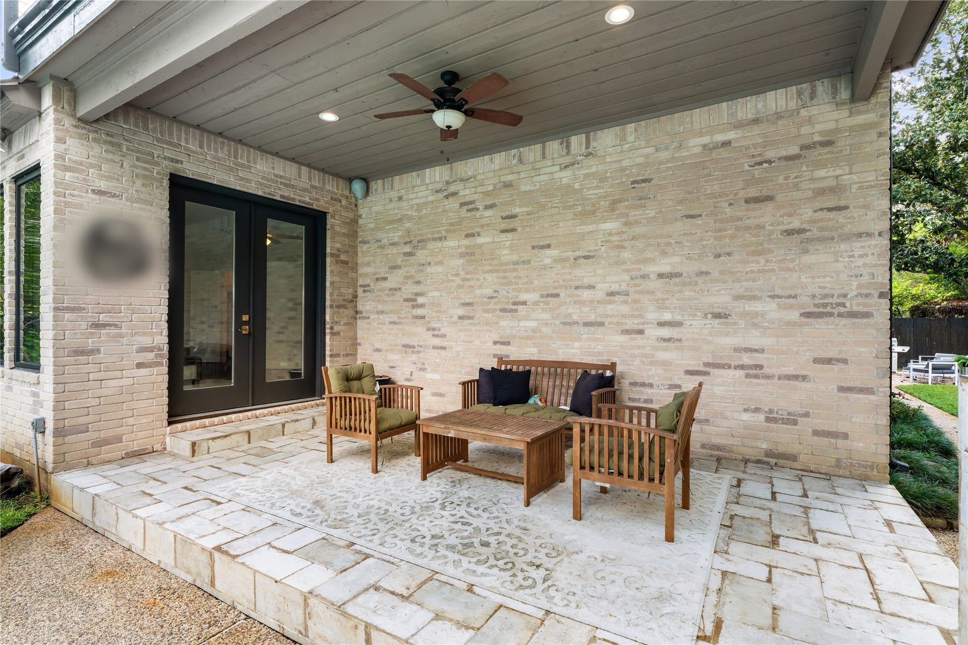 4719 Breezy Point Drive, Houston, TX 77345 A spacious covered patio extends the home's living space outdoors with a ceiling fan, recessed lighting, and direct access to the interioran inviting setting for relaxing or entertaining beside the pool.